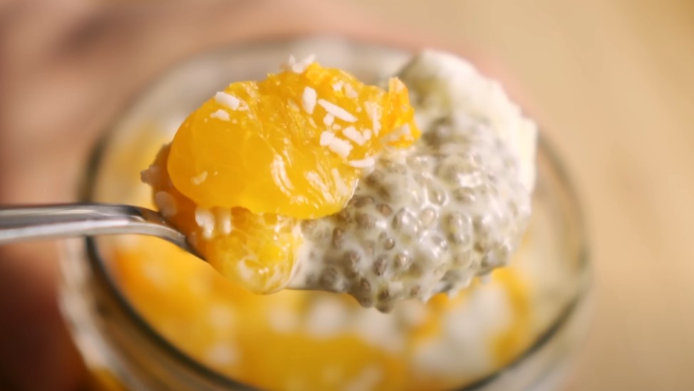 A colorful chia pudding in a spoon