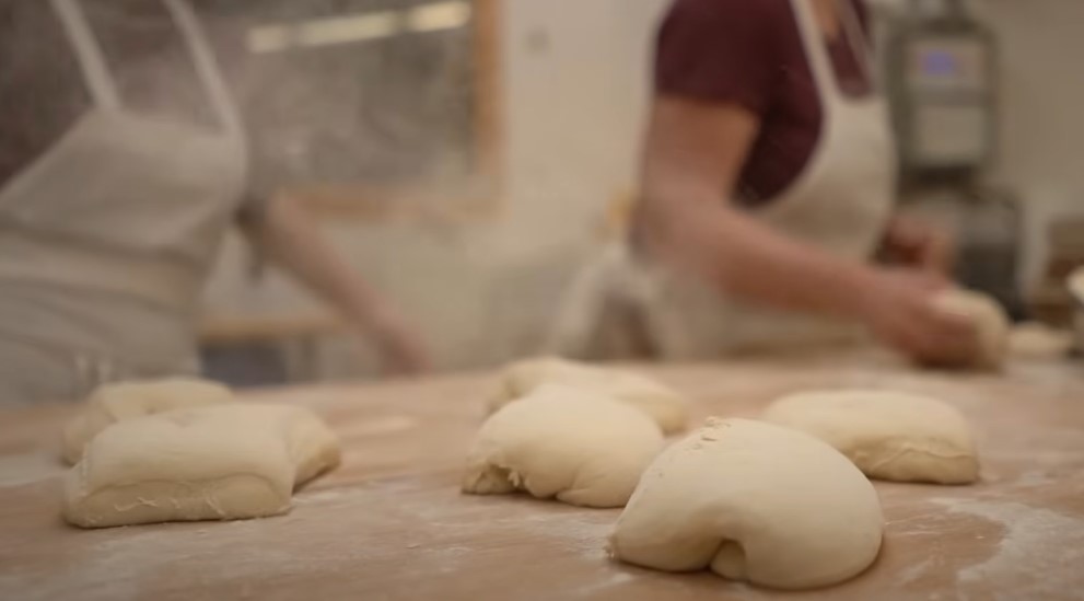 Soft, yielding dough, sculpted by skilled hands