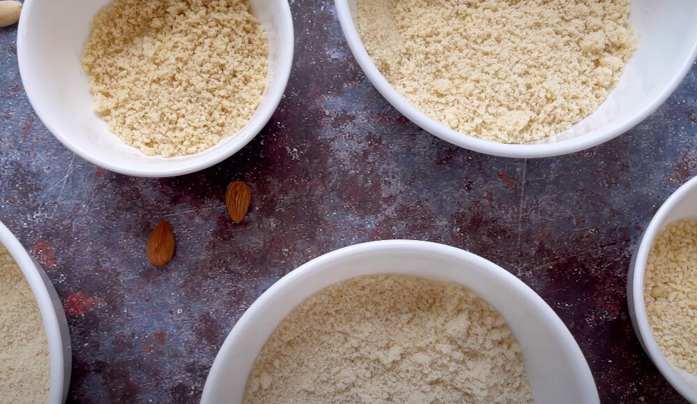 White bowls brimming with the golden essence of almond flour